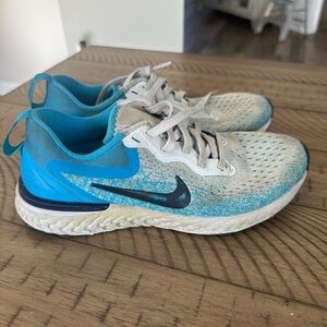 Used and well worn women’s Nike running sneakers, size 6
